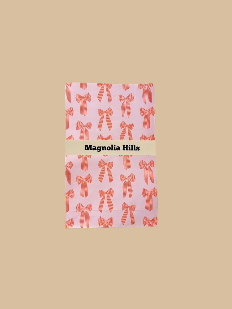 Block Bottom Bag Schleifenmotiv Orange-Rot auf rosafarbenem Hintergrund