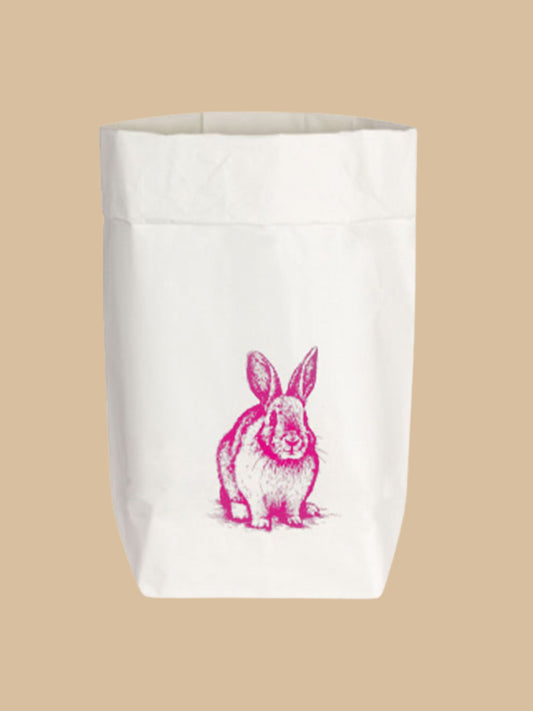 Paperbag/Geschenktüte "Hase sitzend" mit Schriftzug in Neon-Pink auf weißem Hintergrund von 17;30 Hamburg