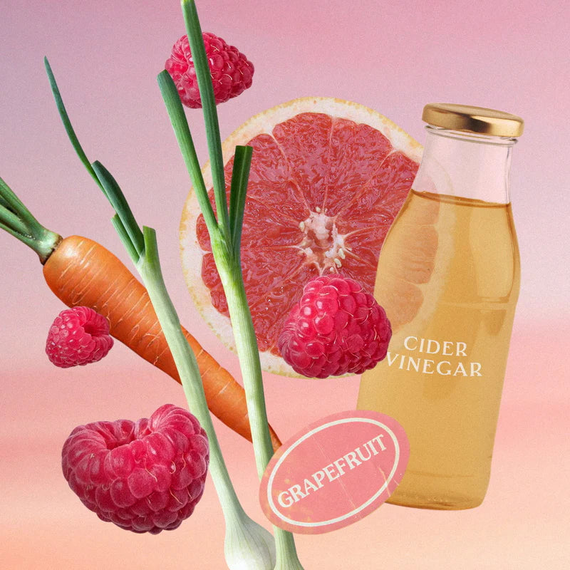 Abgebildete Inhaltsstoffe des Tees: Karotte, Himbeere, Grapefruit, Apfelessig